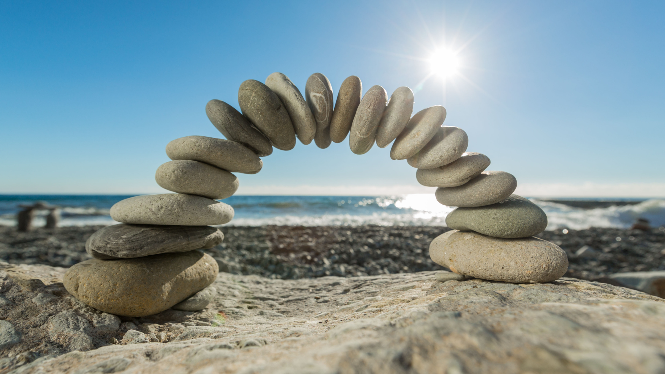 balanced stones on a beach